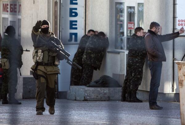 Armed forces arrest Ukrainian army officers during an operation in Simferopol on March 18, 2014. (ALISA BOROVIKOVA/AFP/Getty Images)