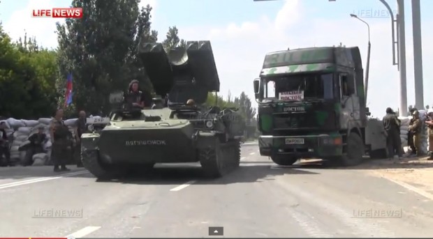 Screen grab from LifeNews video 10 July 2014 of Strela driven past separatist checkpoint in Donetsk, believed to have come from Russia.