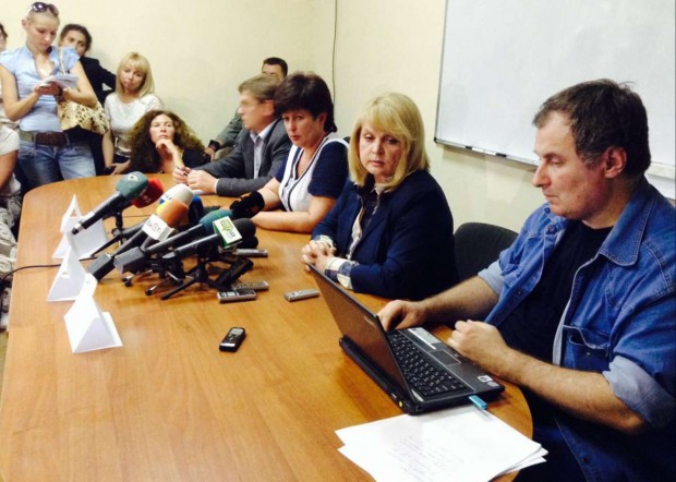 Aleksandr Cherkassov of Memorial Human Rights Center, foreground, with other Russian and Ukrainian human rights advocates at a meeting of the Ukrainian Human Rights Ombud Valeriya Lutkovskaya and Russian Human Rights Ombud Ella Pamfilova 13 June 2014 during a joint mission to Ukraine.