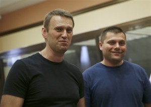 Alexei Navalny and his alleged accomplice Pyotr Ofitserov after their release | AP