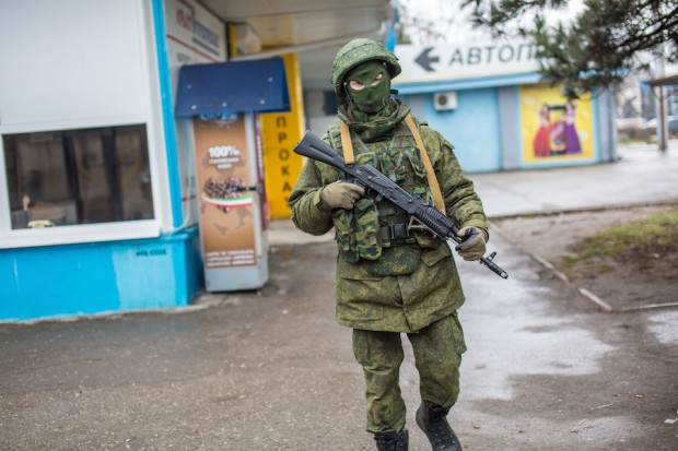 Armed man at airport building in Simferopol. Photo by Andrei Stenin/RIA Novosti