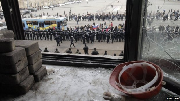 Interior ministry troops block a group of pro-Russia protesters in Kharkiv | Reuters