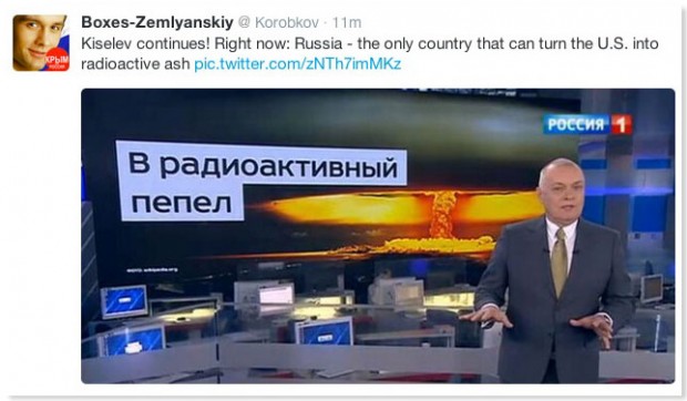 Dmitry Kiselyev speaks on Rossiya 1 with a sign saying "radioactive ash" describing how Russia is the only country that could prevail over America in a nuclear war.